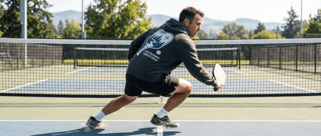 “Player practicing pickleball agility drills at the kitchen line.”