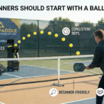 ALT: “Beginner pickleball player practicing with a ball machine on an outdoor court, showing consistent feeds and controlled strokes for confidence-building reps.”